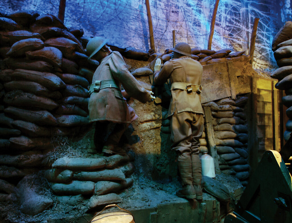 a view from inside a bunker with two soldiers working together 