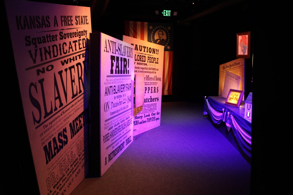 Custom-created exhibits about Abraham Lincoln's life with oversized newspapers