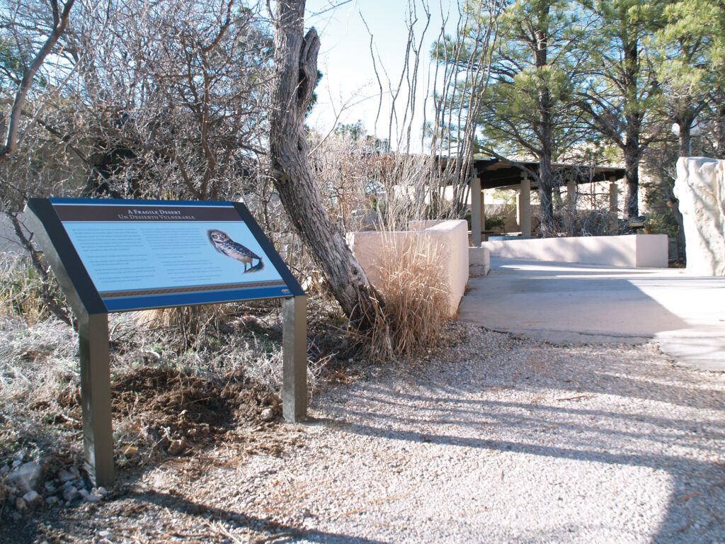 Walkway at Living Desert Zoo showing an outdoor custom-made sign providing additional information for visitors